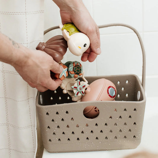 Neutral silicone bath caddy to hold bath toys and necessities